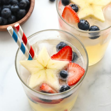 4th of july mocktails with red, white, and blue straws.