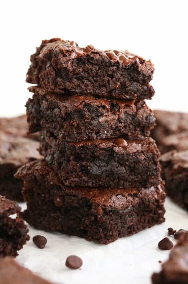 almond flour brownies stacked with white background.