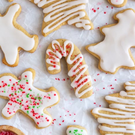 frosted almond flour sugar cookies with sugar on top.