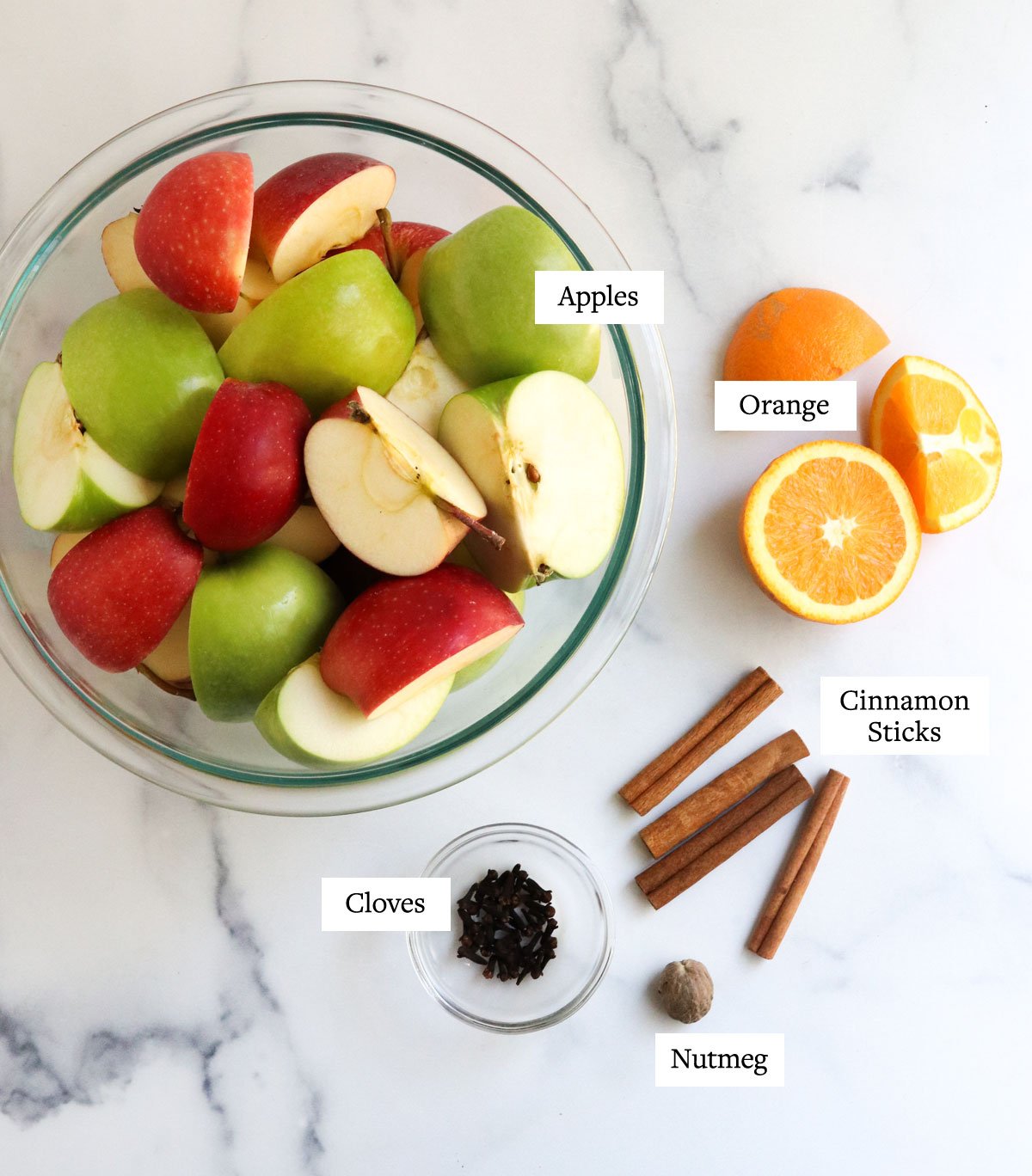 apple cider ingredients in glass bowls