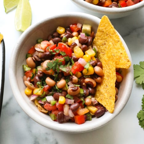 cowboy caviar closeup with corn tortilla chips.