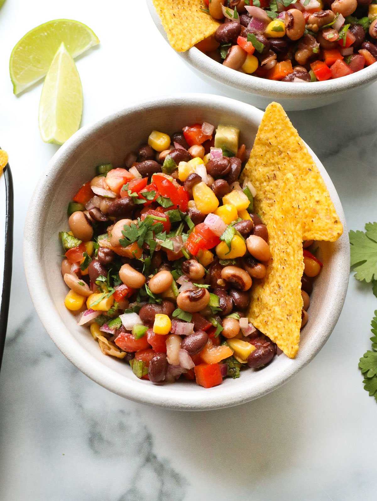 cowboy caviar closeup with corn tortilla chips.