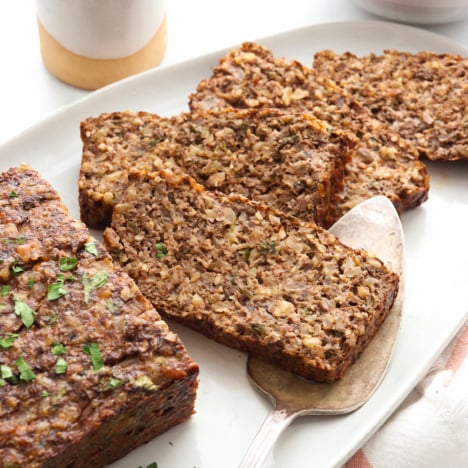 nut roast slices on a white serving platter.