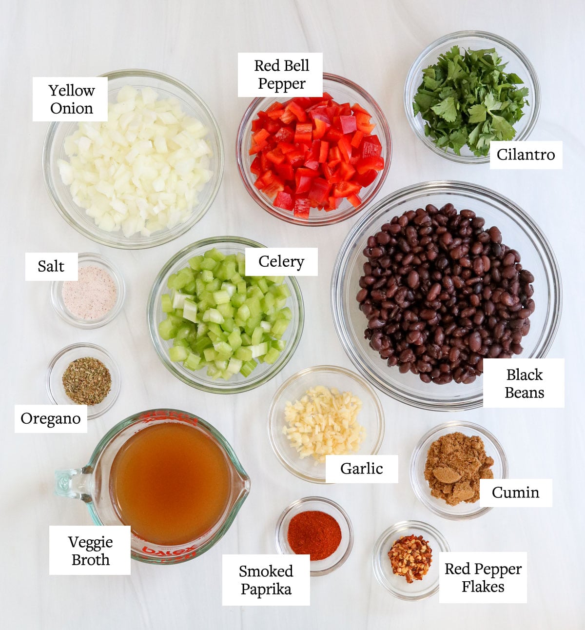 black bean soup ingredients in glass bowls.