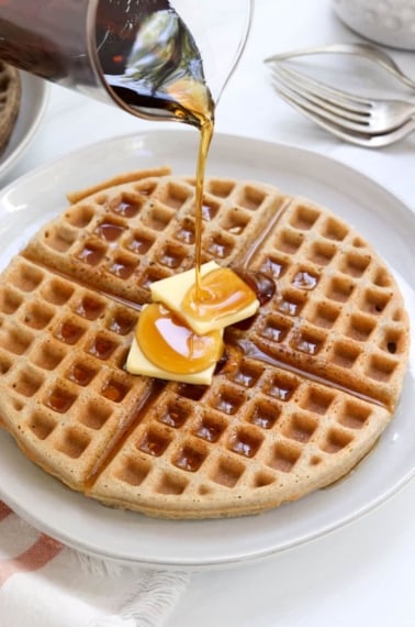 buckwheat waffle with butter and syrup on top.