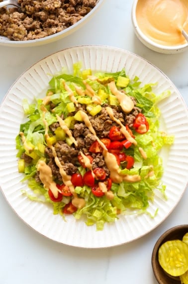 big mac salad served on a large white plate.