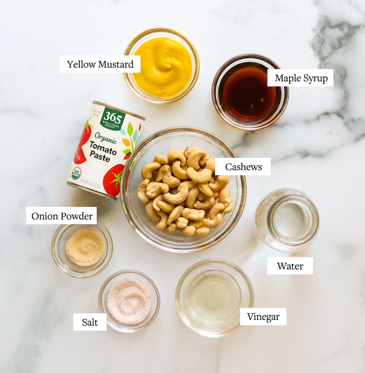 burger sauce ingredients labeled in glass bowls.