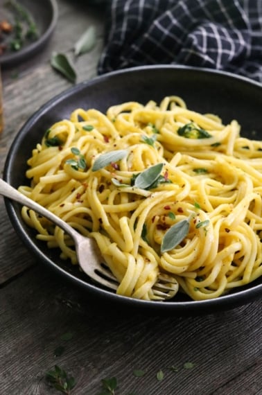 butternut squash pasta in black bowl