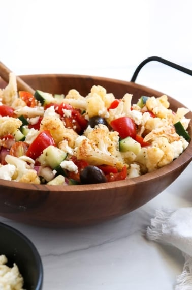 cauliflower salad from the side in wooden bowl