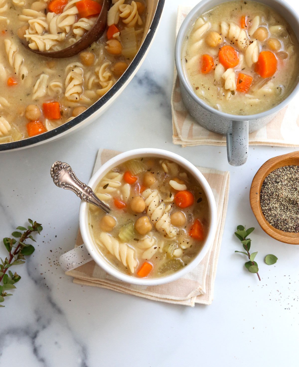 chickpea noodle soup overhead in mugs