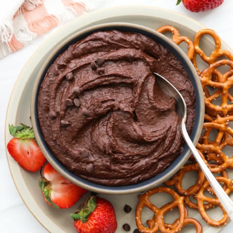 chocolate hummus served with fruit and pretzels.