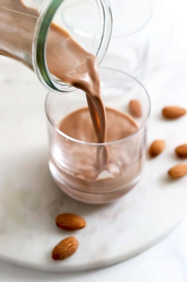 chocolate almond milk poured into glass