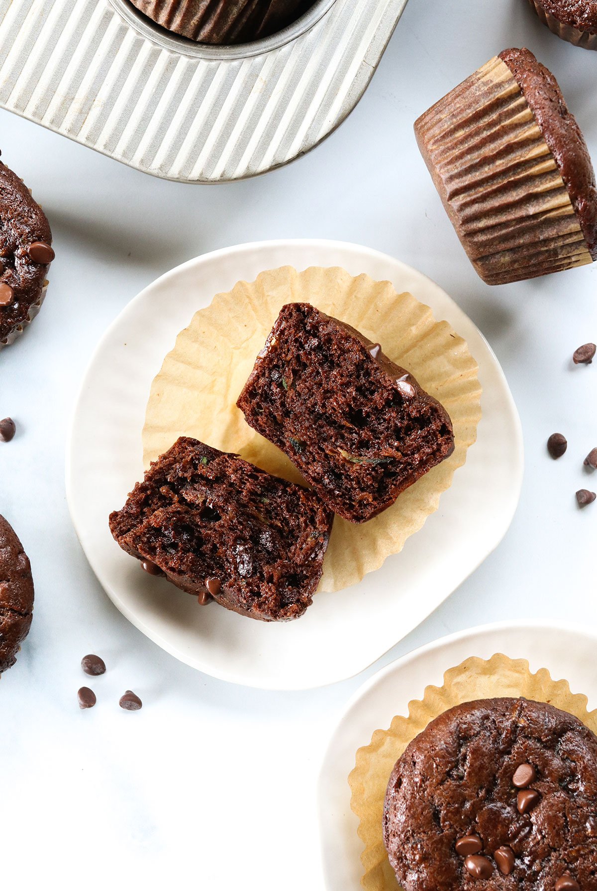 chocolate zucchini muffin split in half to show the texture without using flour.