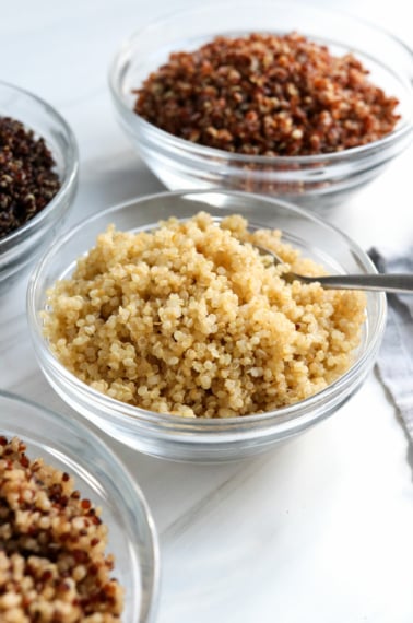 cooked quinoa in glass bowls.