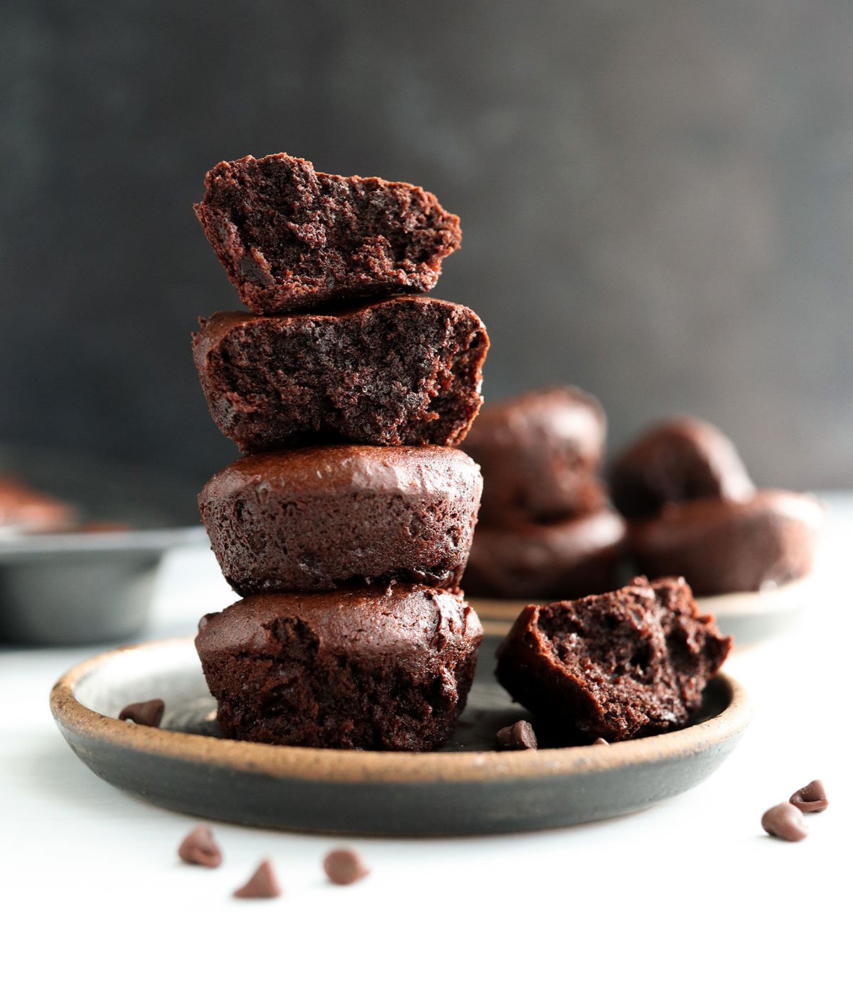 date brownies stacked on dark plate.