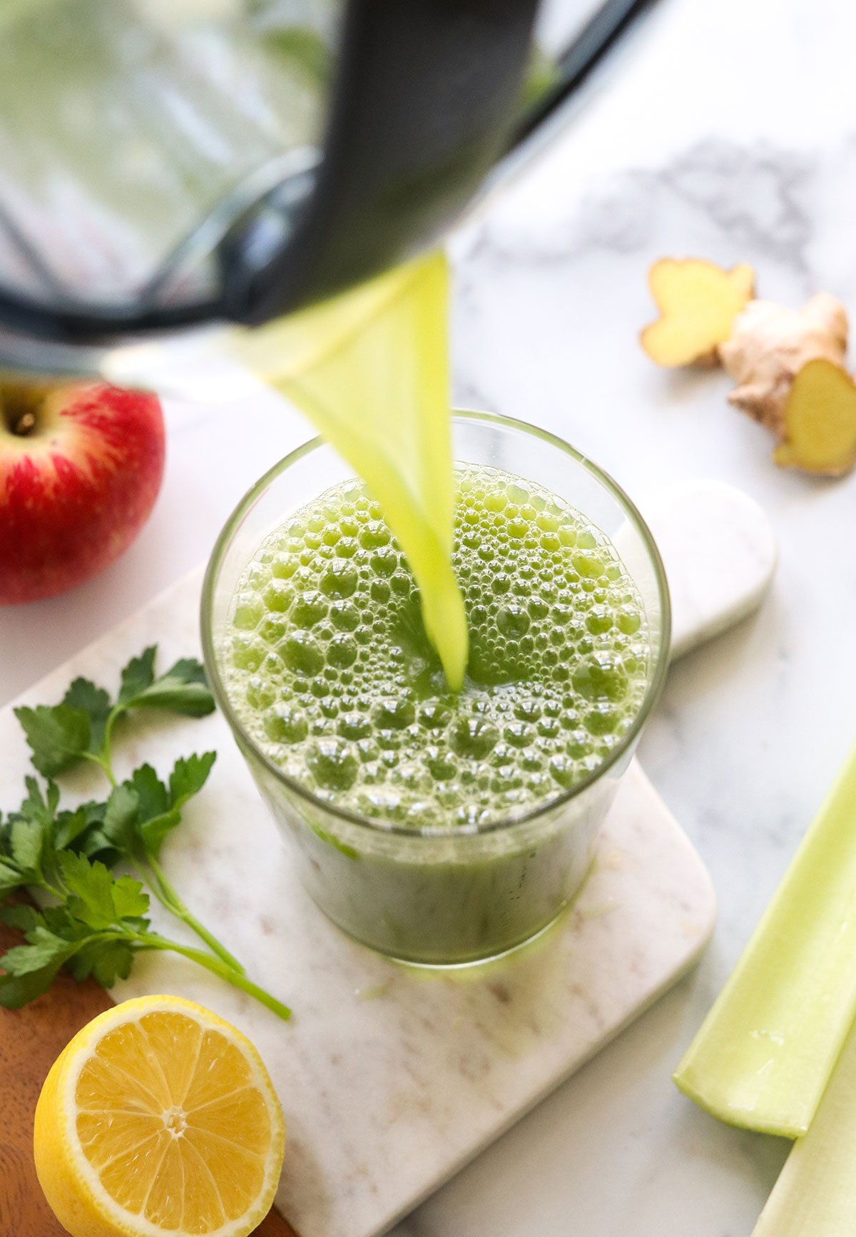 green juice poured into a glass.