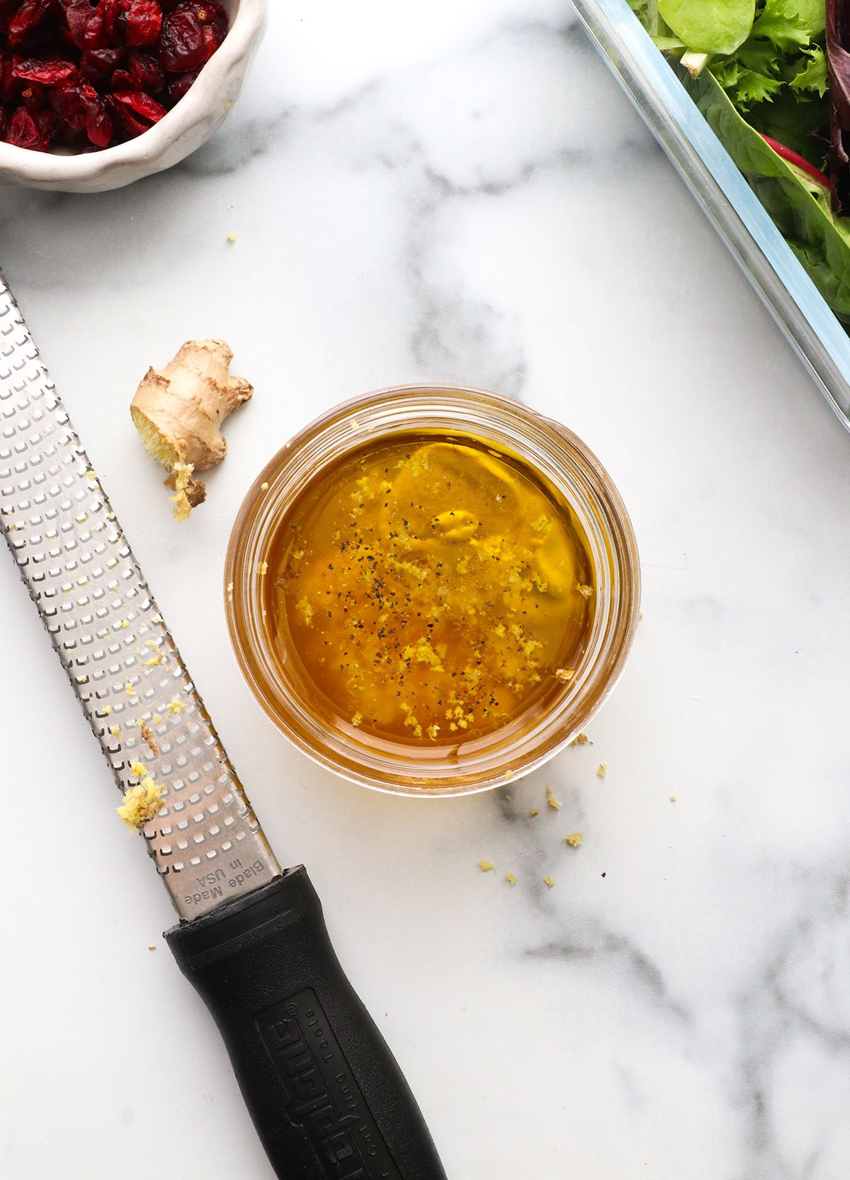 ginger grated into a small jar of salad dressing.