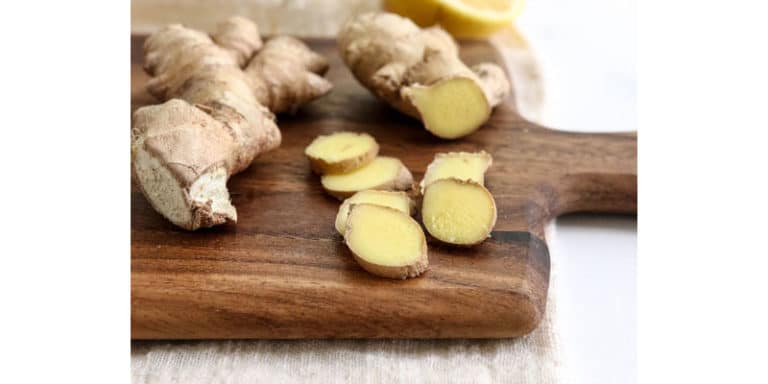 ginger sliced on cutting board