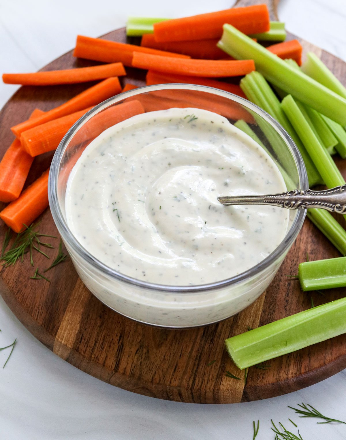 greek yogurt dressing served with sliced veggies.