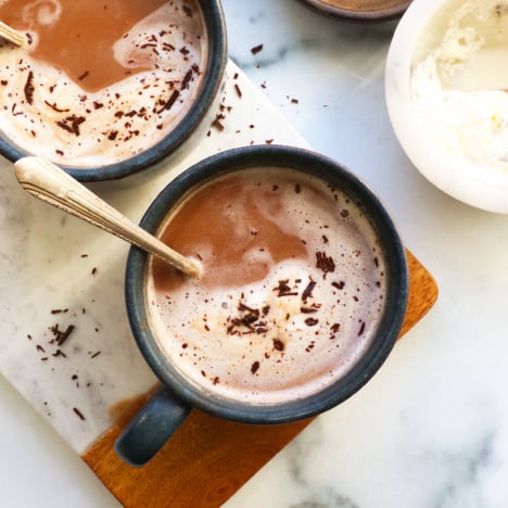 healthy hot chocolate with melted whipped cream on top.