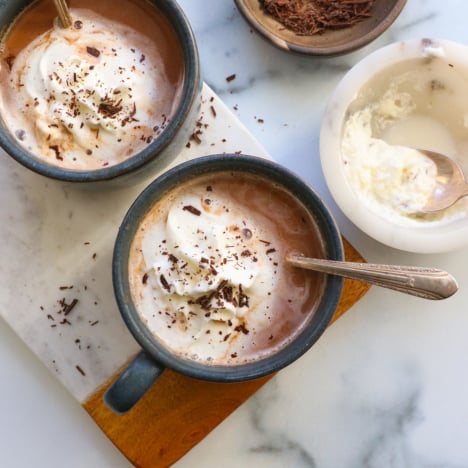 healthy hot chocolate topped with whipped cream and shaved chocolate.