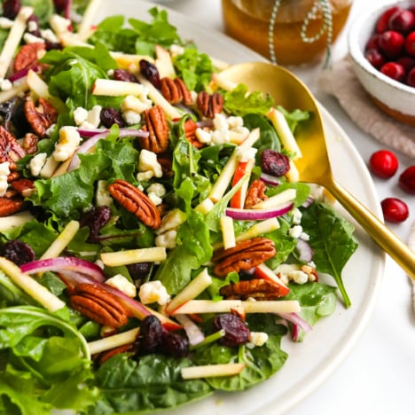 holiday salad topped with apples and pecans.