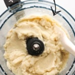 mashed cauliflower in a food processor labeled for Pinterest.