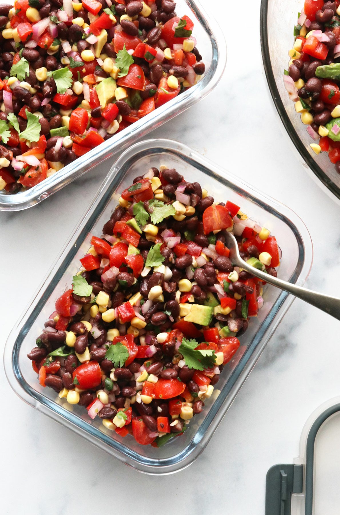 black bean and corn salad added to 2 glass storage jars. 