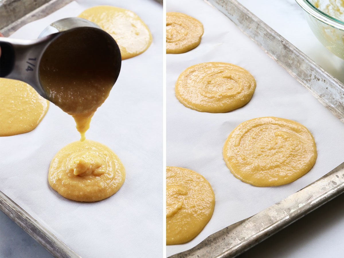 batter poured onto a lined baking sheet for pancakes.