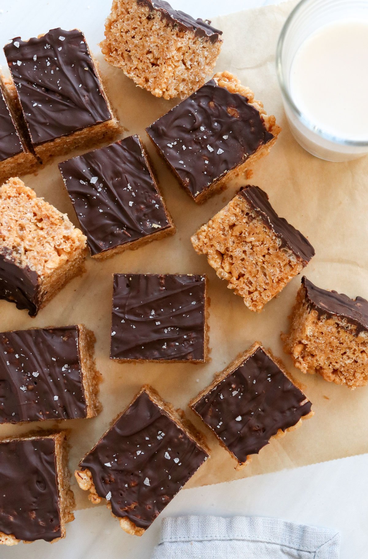 peanut butter krispie treats sliced on parchment paper.