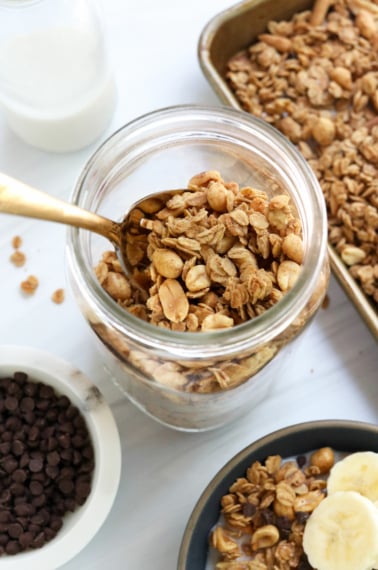 peanut butter granola in a large glass mason jar.