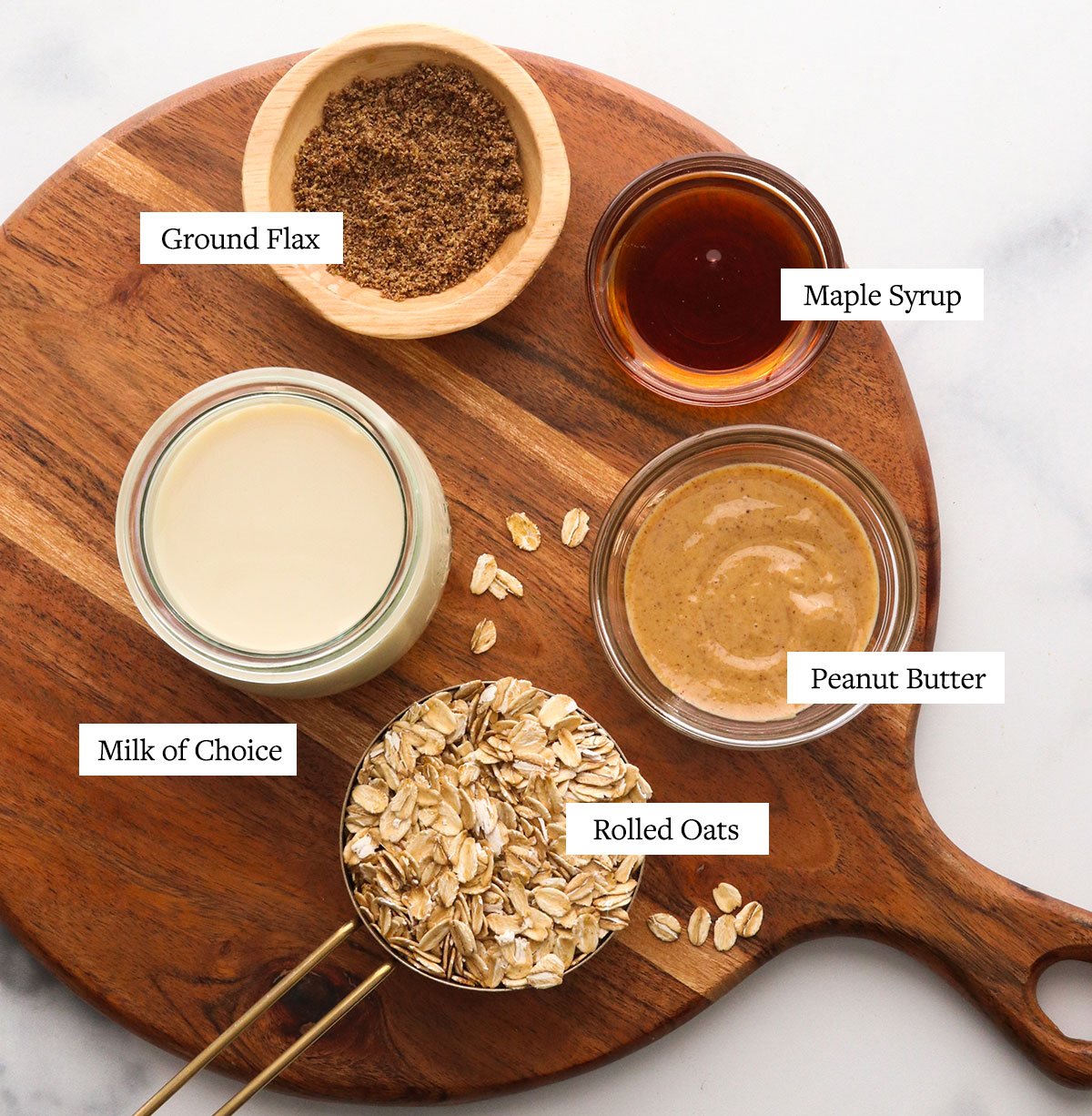 peanut butter overnight ingredients labeled on a wooden board.