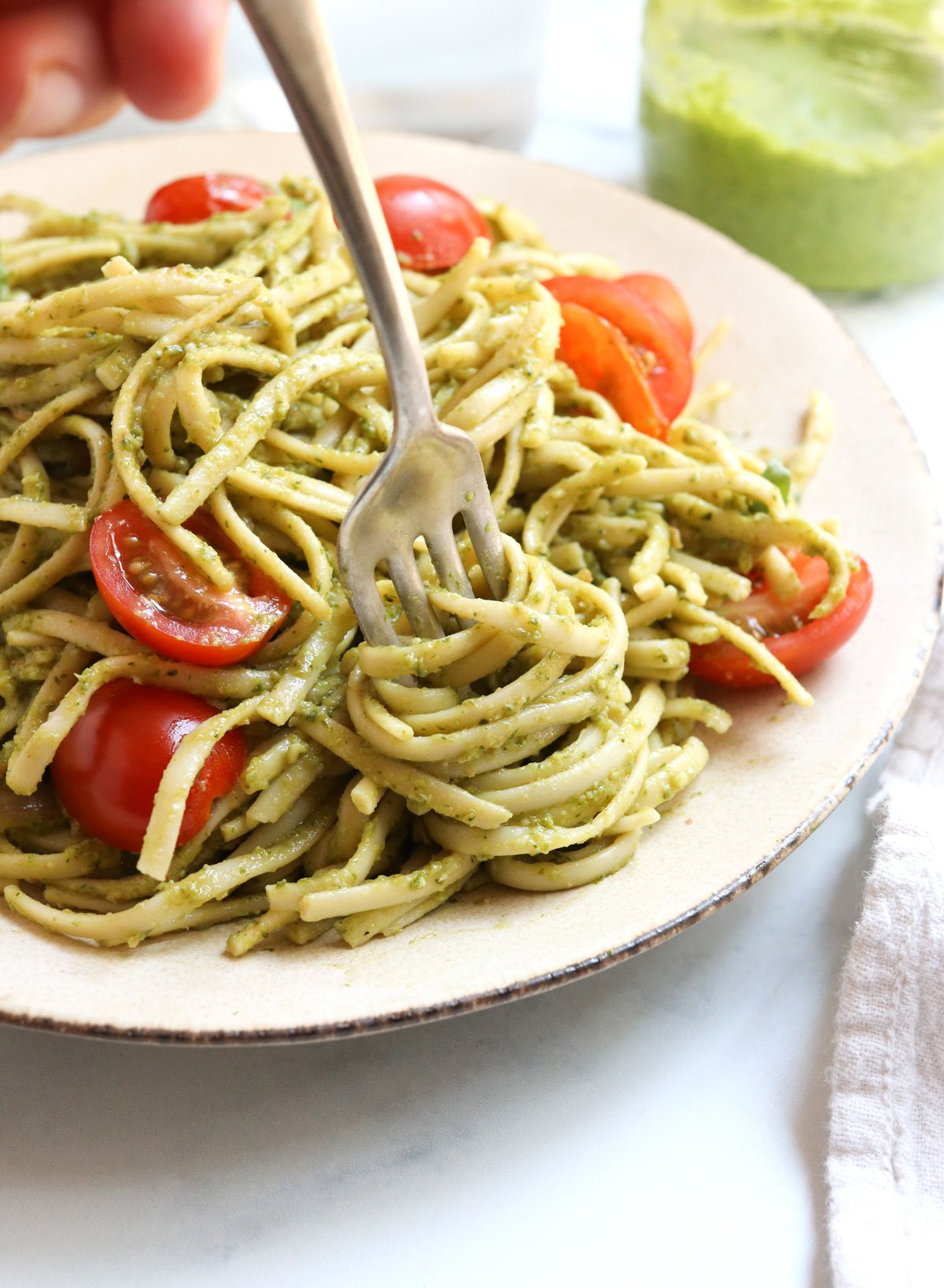 pesto pasta twirled on fork