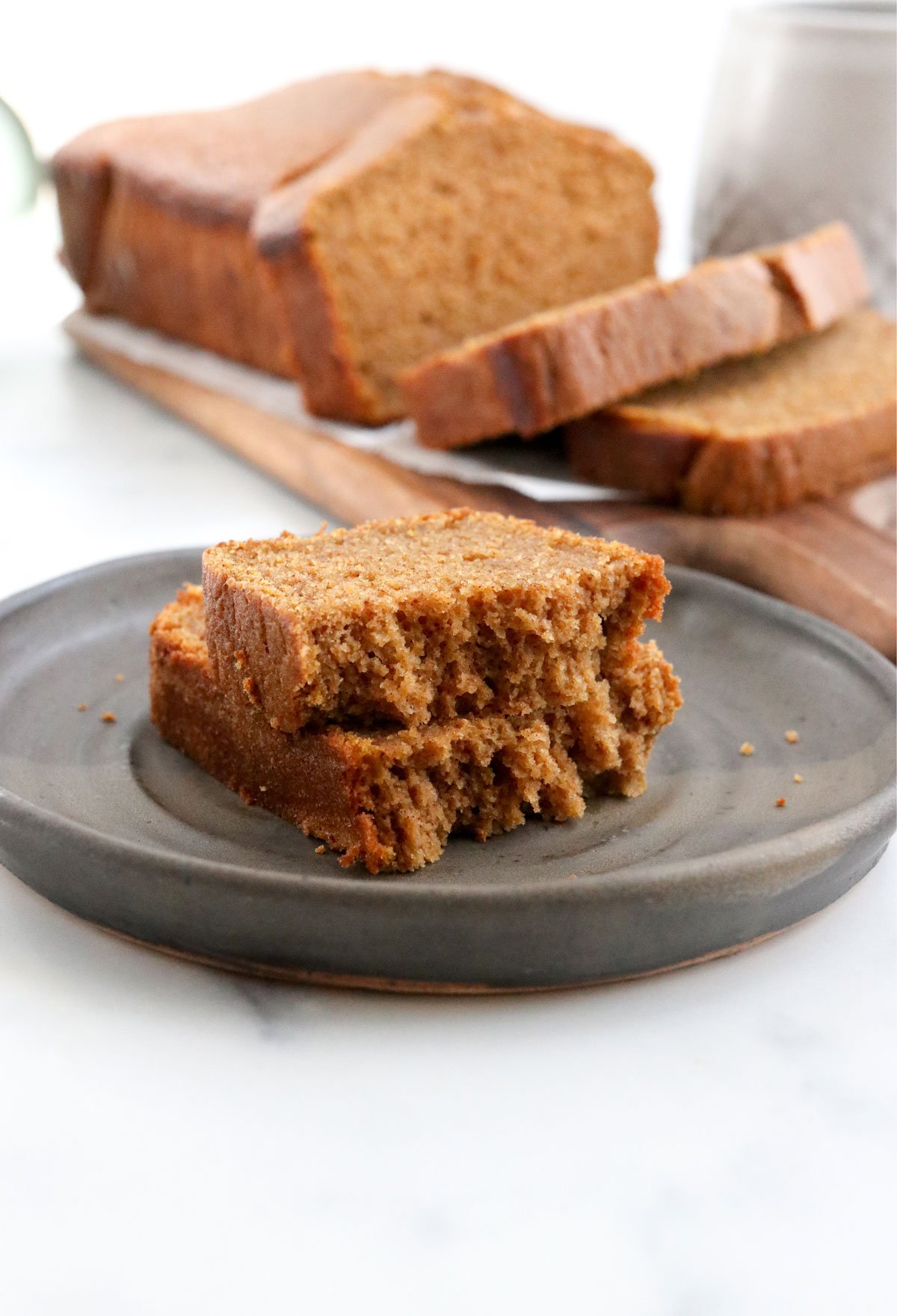 pumpkin bread slice in half on plate