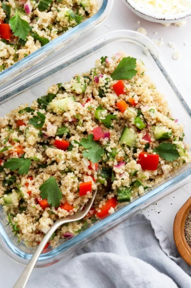 quinoa salad in two glass meal prep containers.