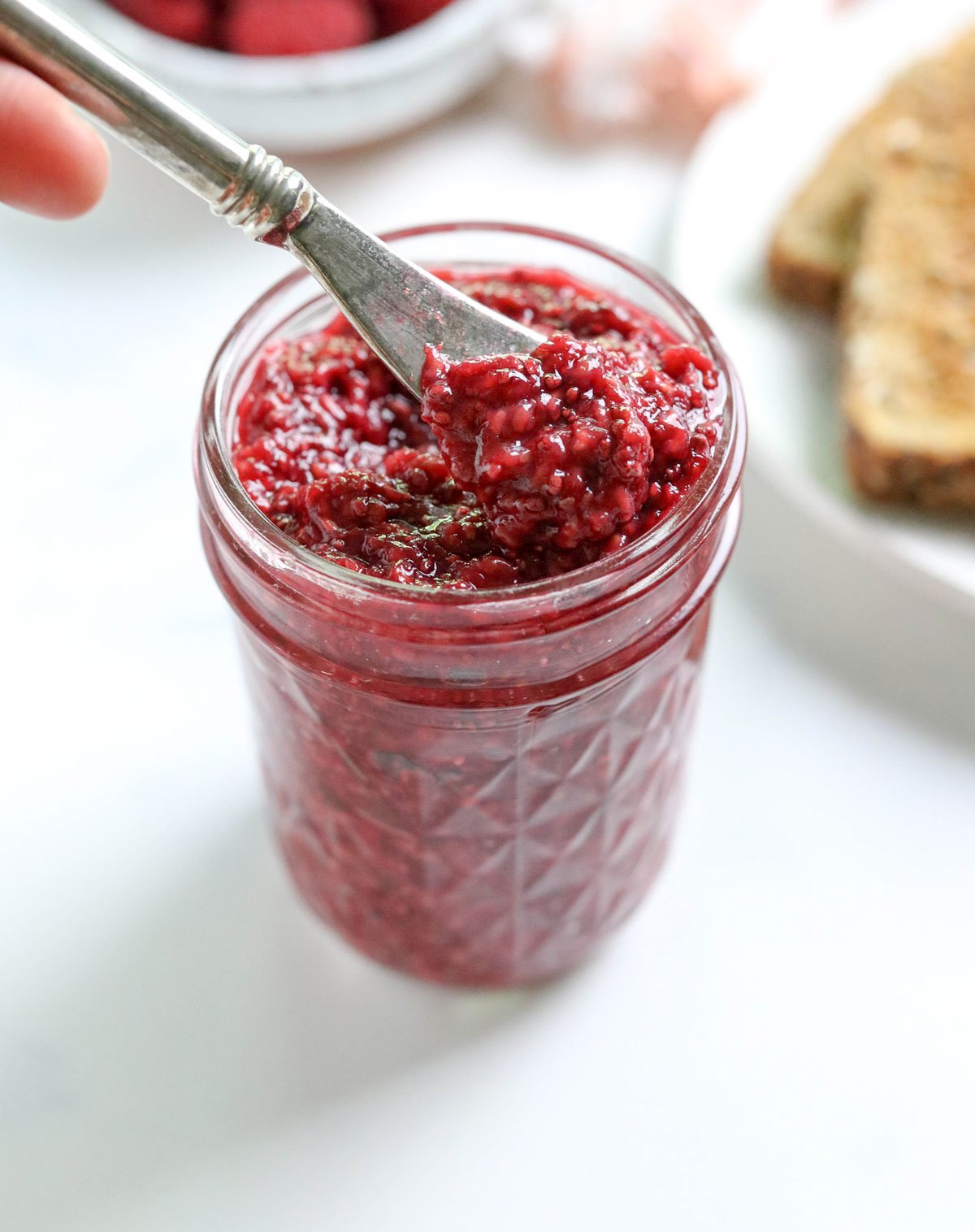 chia seed jam on a knife