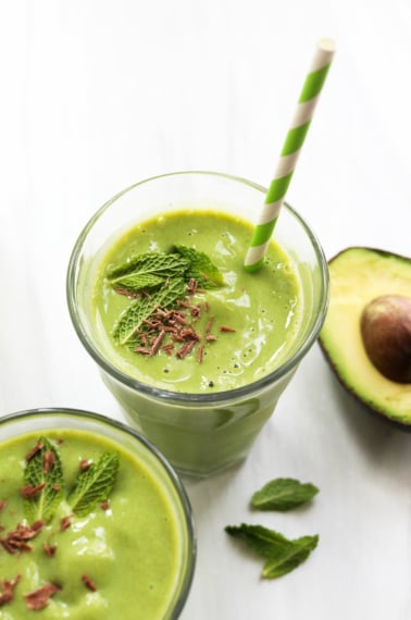 shamrock shake with mint leaves and straw.