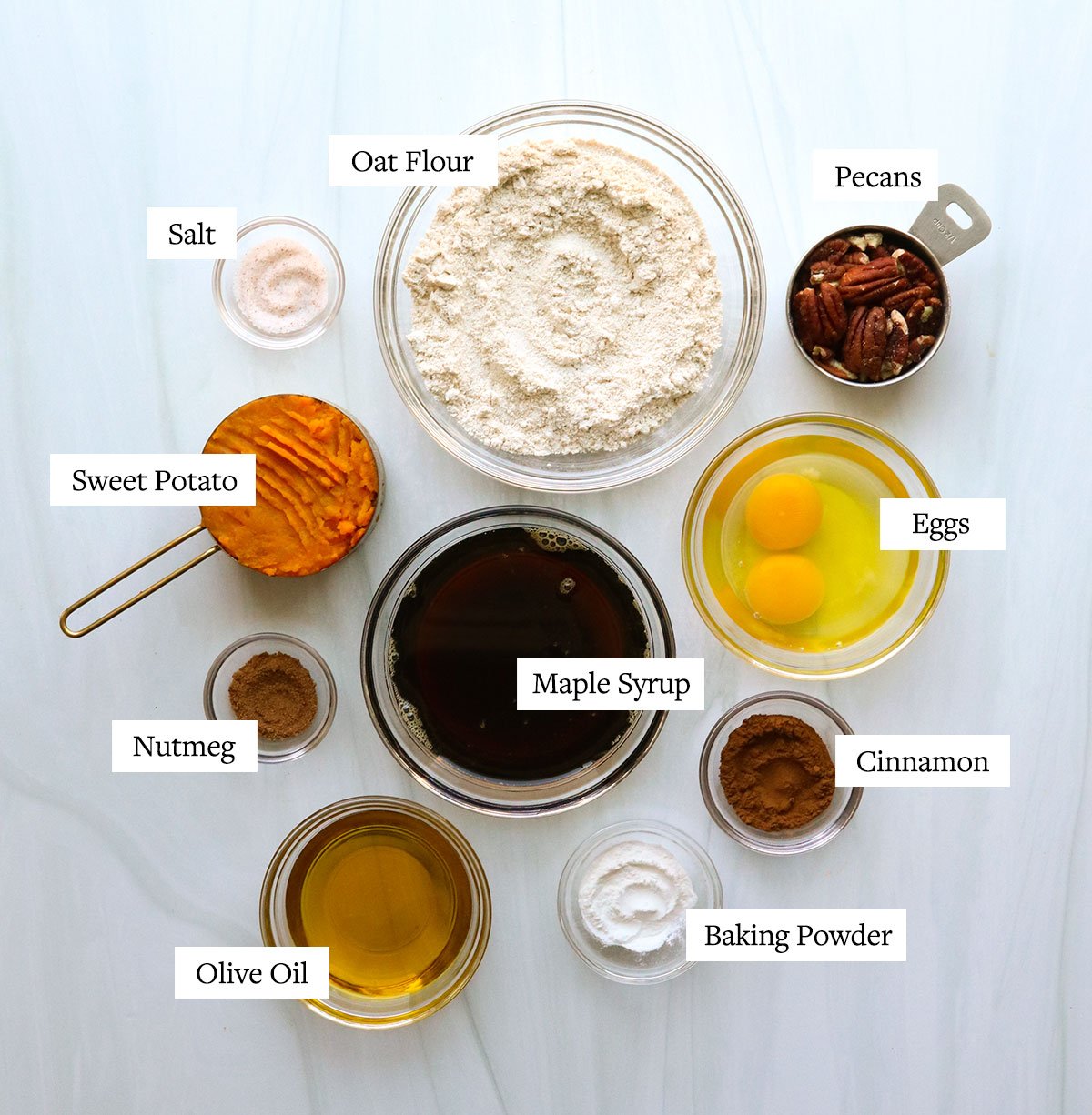 sweet potato muffin ingredients labeled in glass bowls.