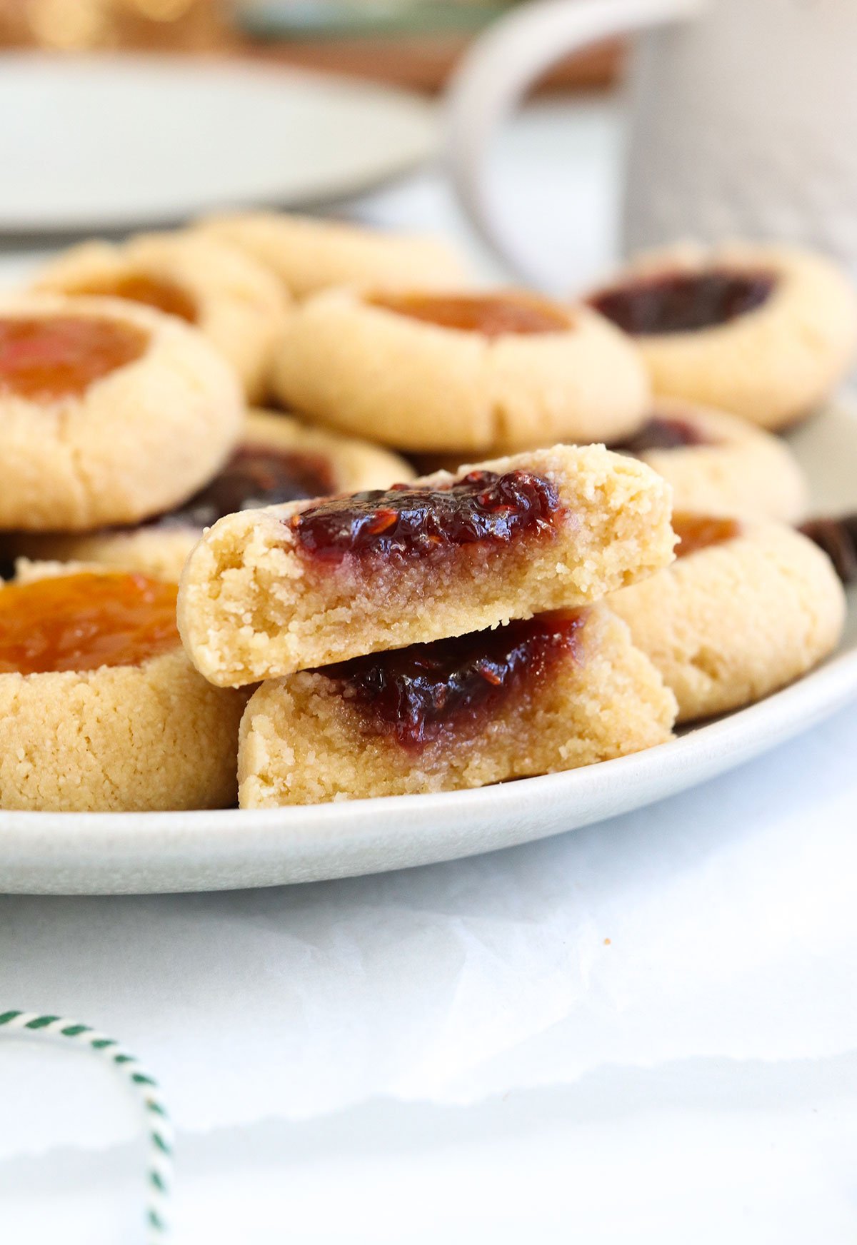 thumbprint cookie split in half to show texture on a plate.