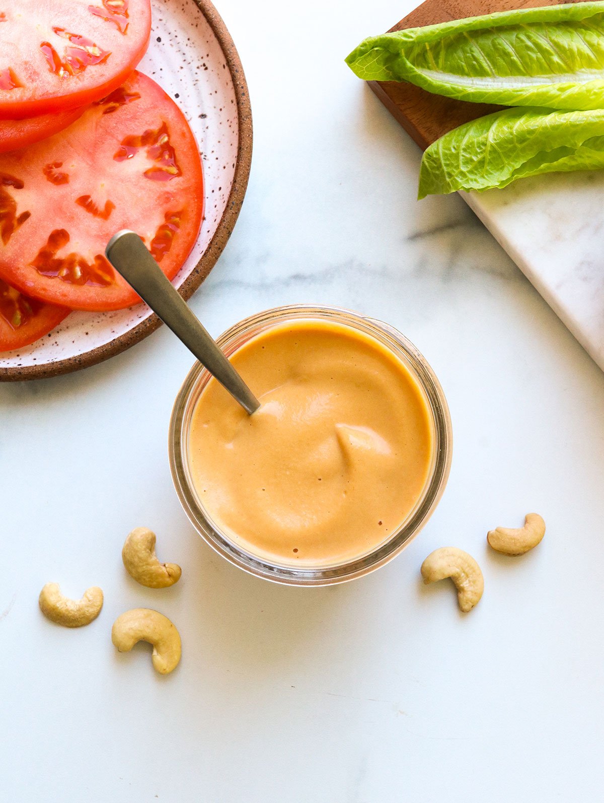 burger sauce in a glass jar with spoon.