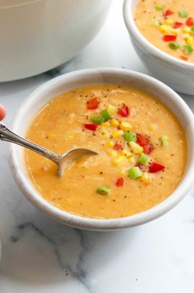 vegan corn chowder in bowl with spoon