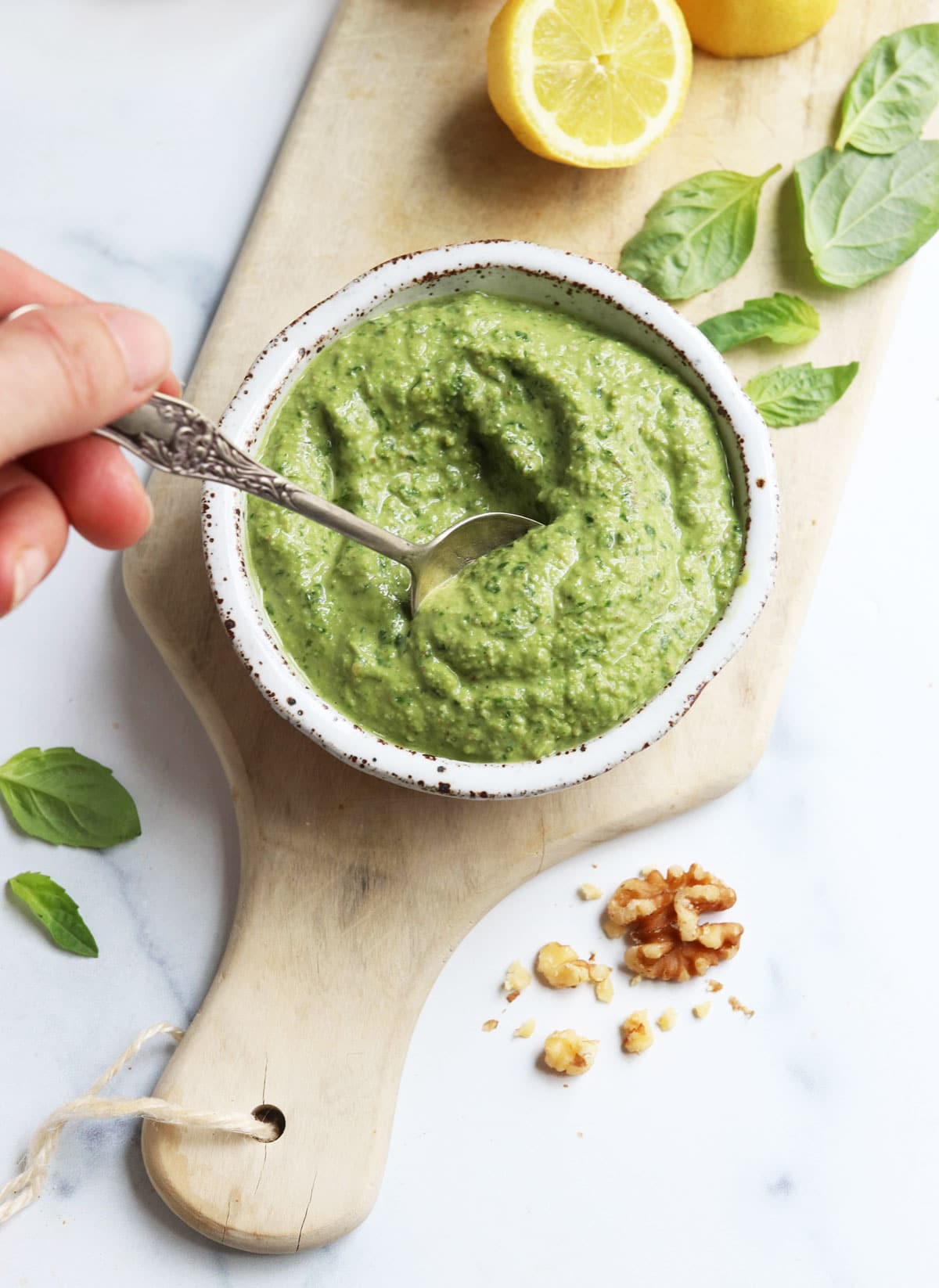 vegan pesto stirred with a spoon