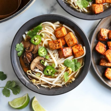 vegan pho in black bowls