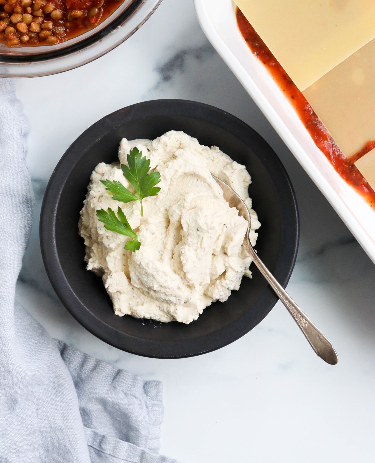 vegan ricotta in a black bowl