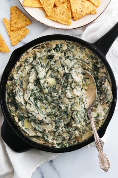 vegan spinach artichoke dip in skillet