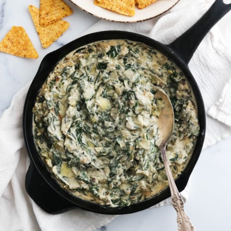 vegan spinach artichoke dip in skillet