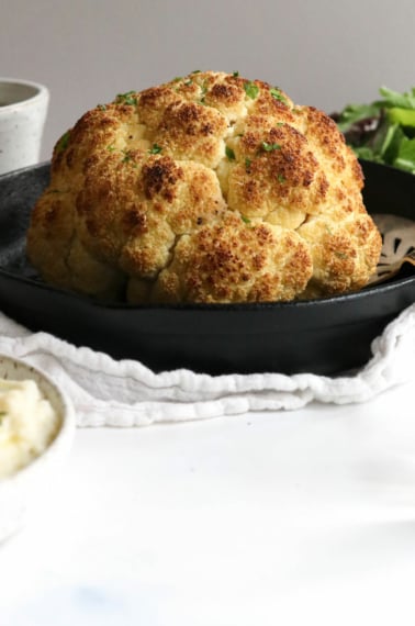 whole roasted cauliflower in pan