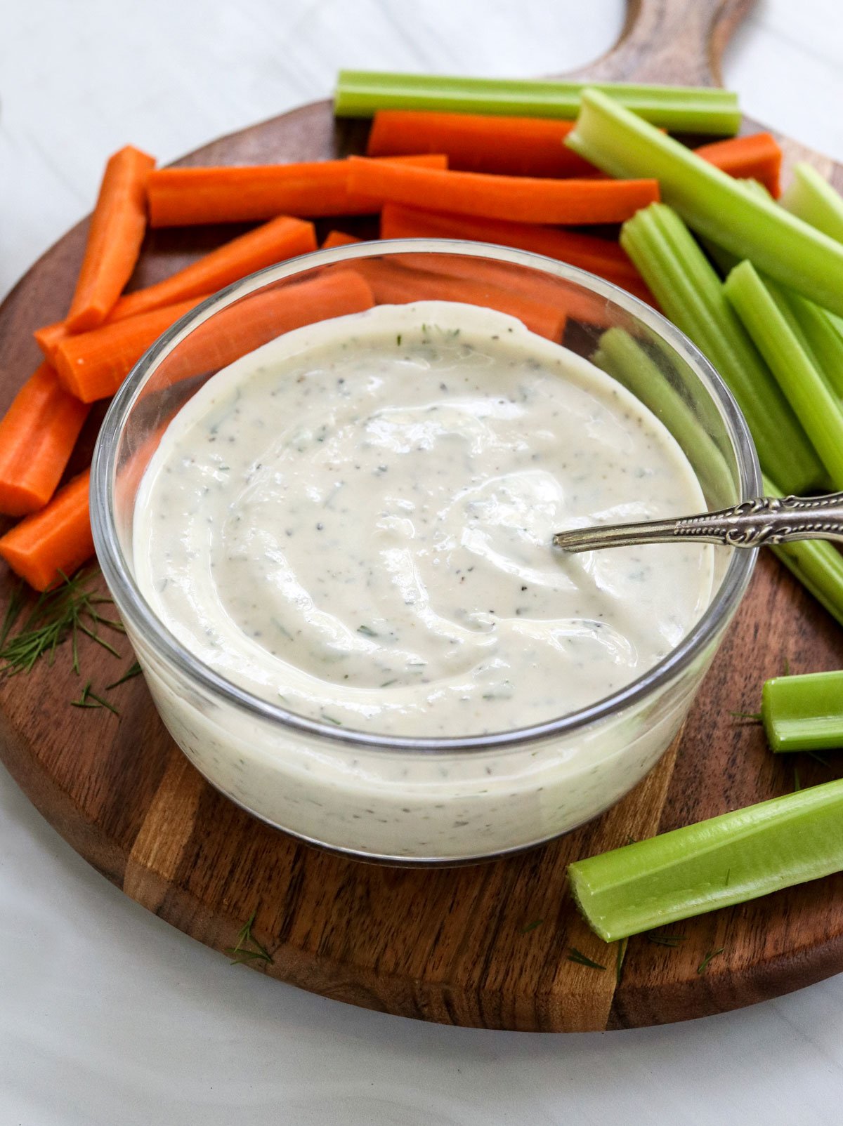 greek yogurt ranch dressing with spoon inside.