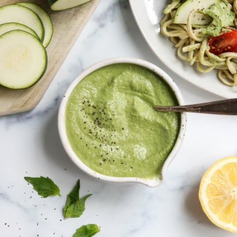 zucchini pesto in white bowl by pasta